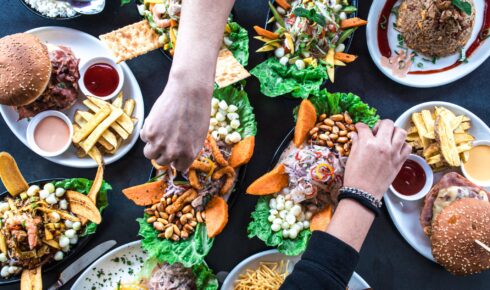 Overhead view of a group of people celebrating and eating in a Peruvian restaurant