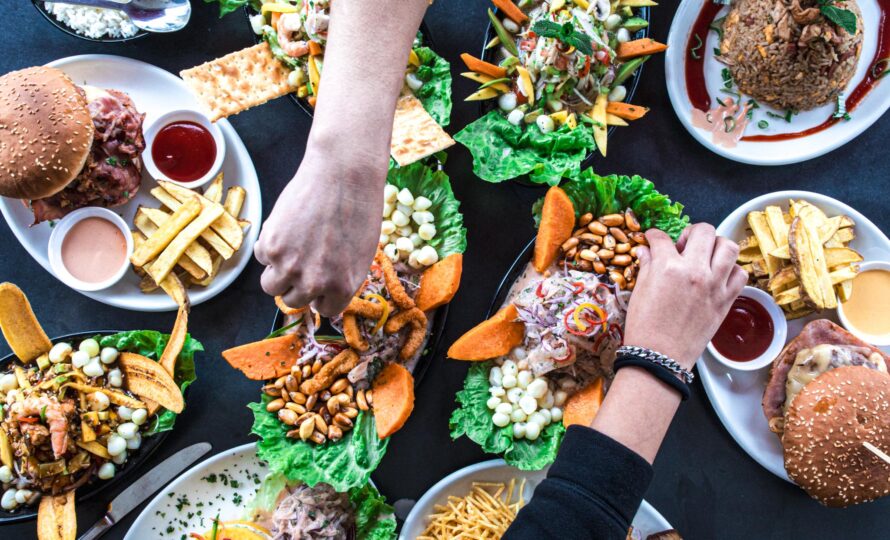 Overhead view of a group of people celebrating and eating in a Peruvian restaurant